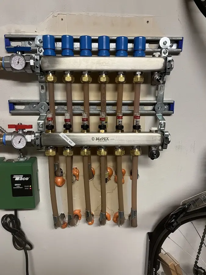 Plumber performing Water Heater Repair at a residential property in Boone